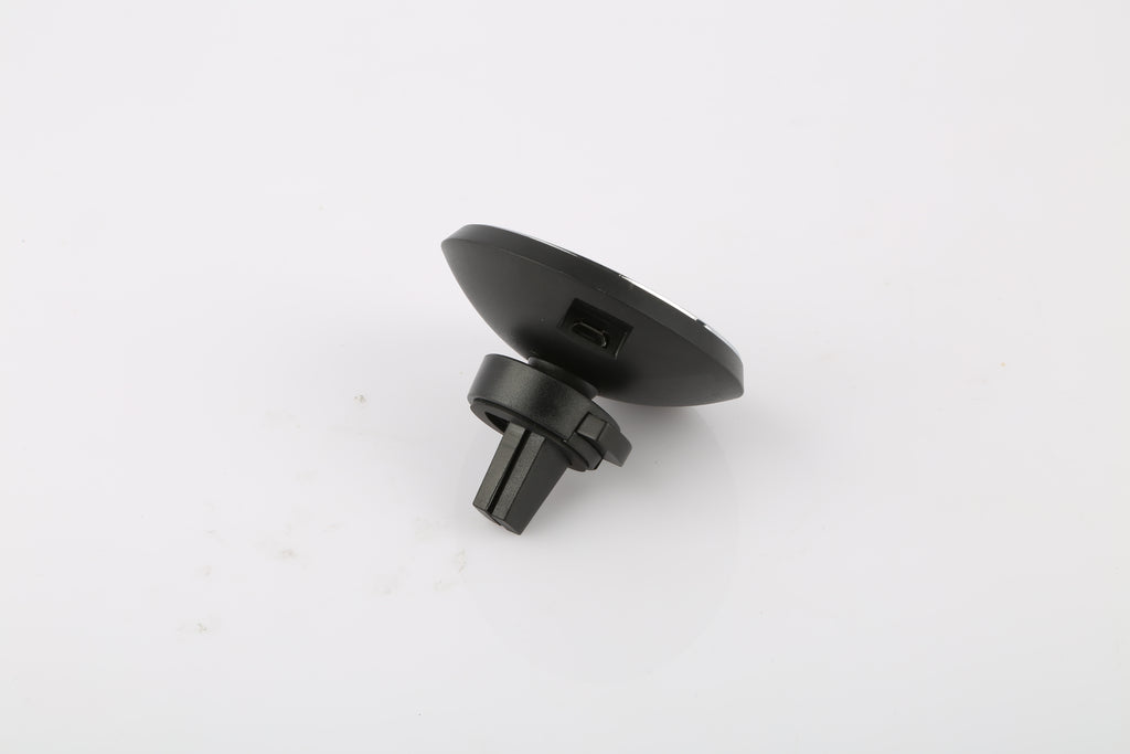 A small black plastic automotive or appliance vent clip with a round mounting base and a short protruding tab, shown on a plain white background.