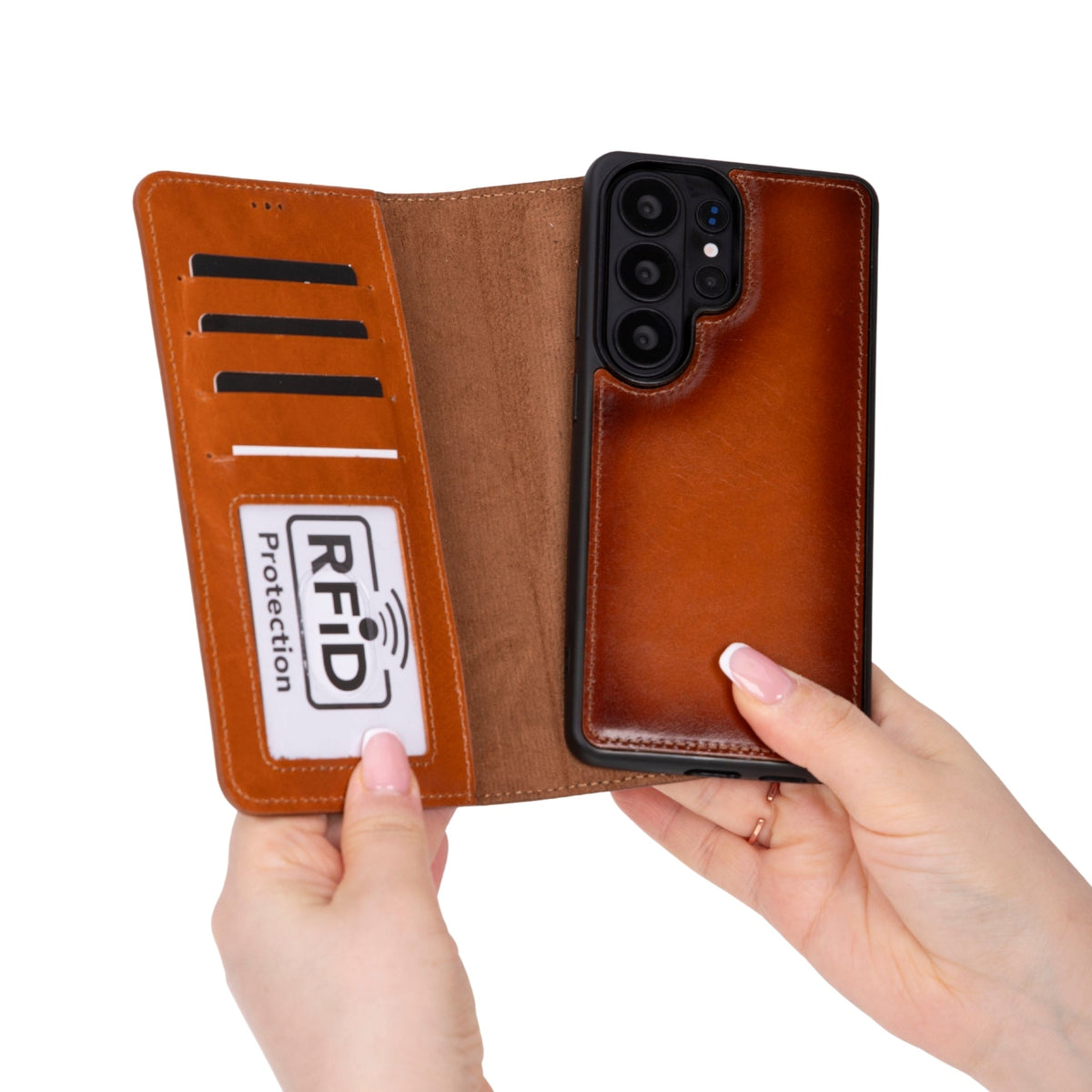 Brown leather phone case with RFID protection label held by a hand on a white background
