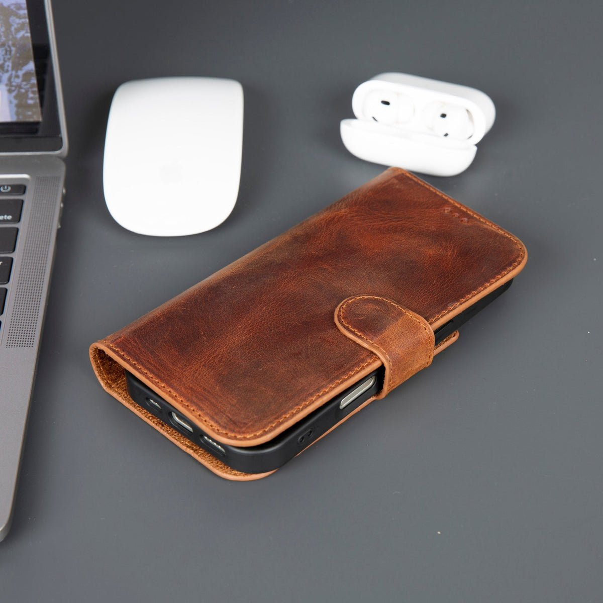 Brown leather wallet phone case closed with its strap