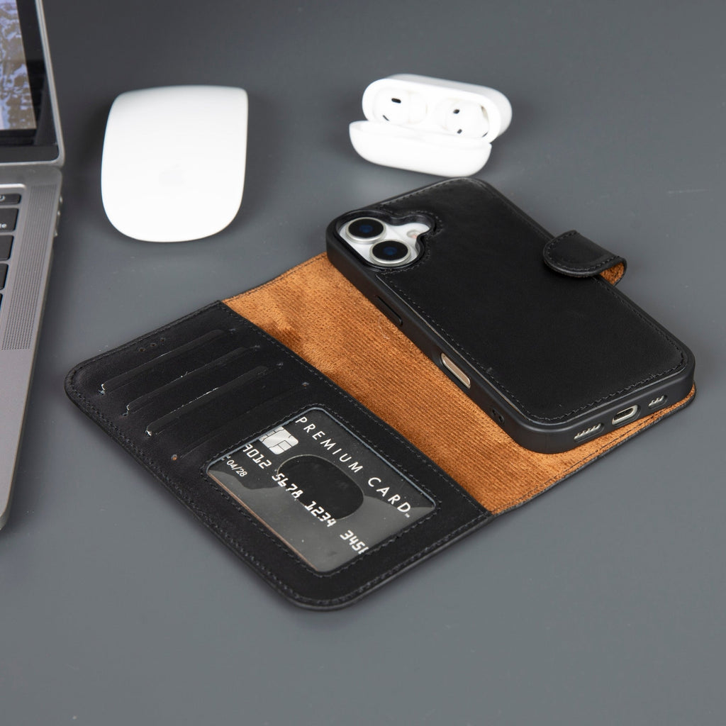 Phone case with card holder on a desk with laptop, mouse, and earbuds.