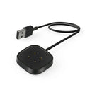 Black USB cable and square device with measurements on a white background